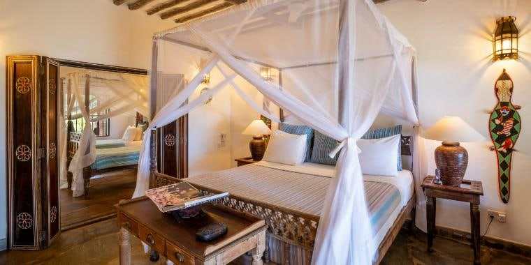 Swahili-style four-poster bedroom at a Diani beach hotel