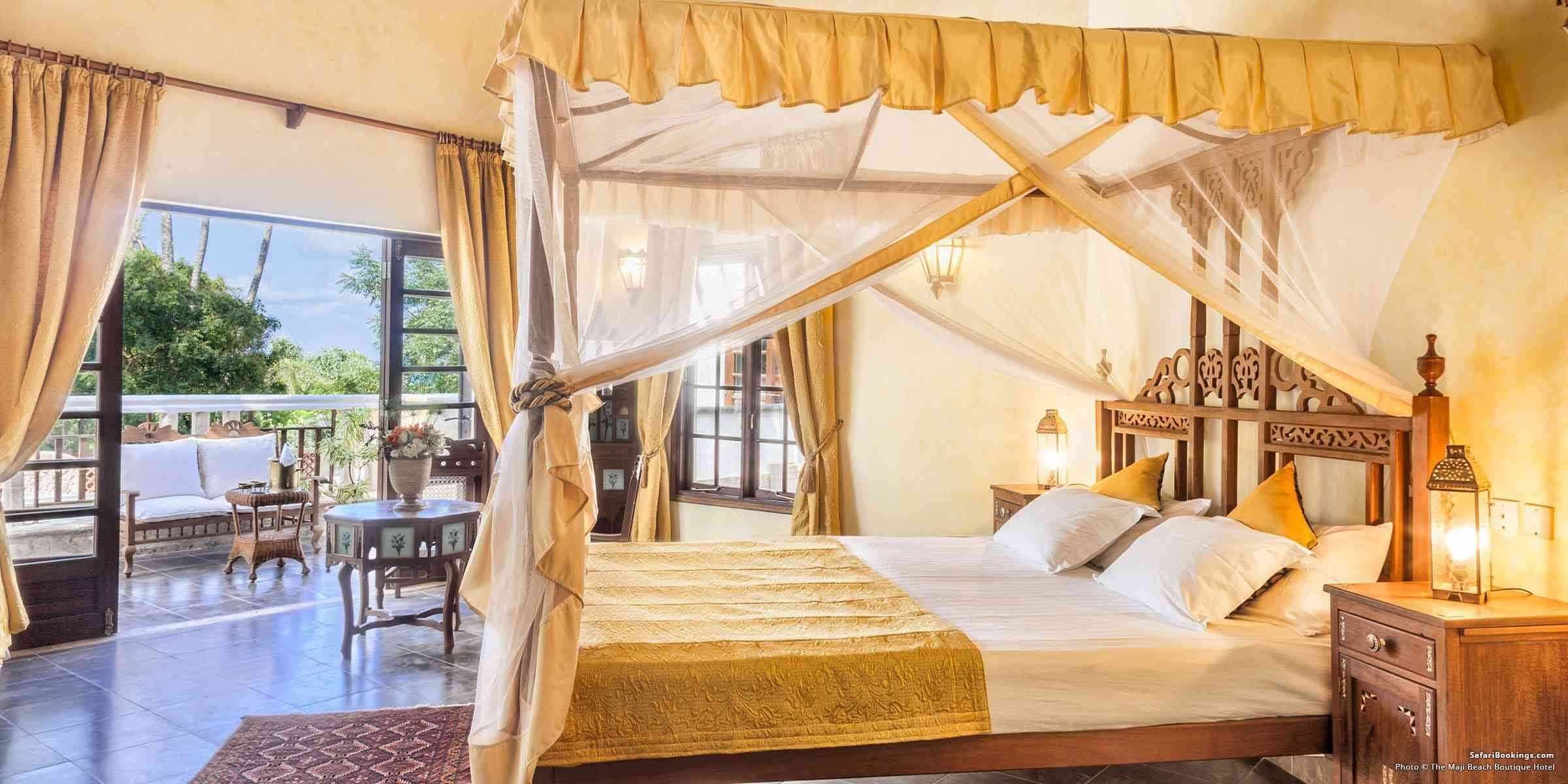 Four-poster suite opening onto a terrace at a Kenya coast beach resort