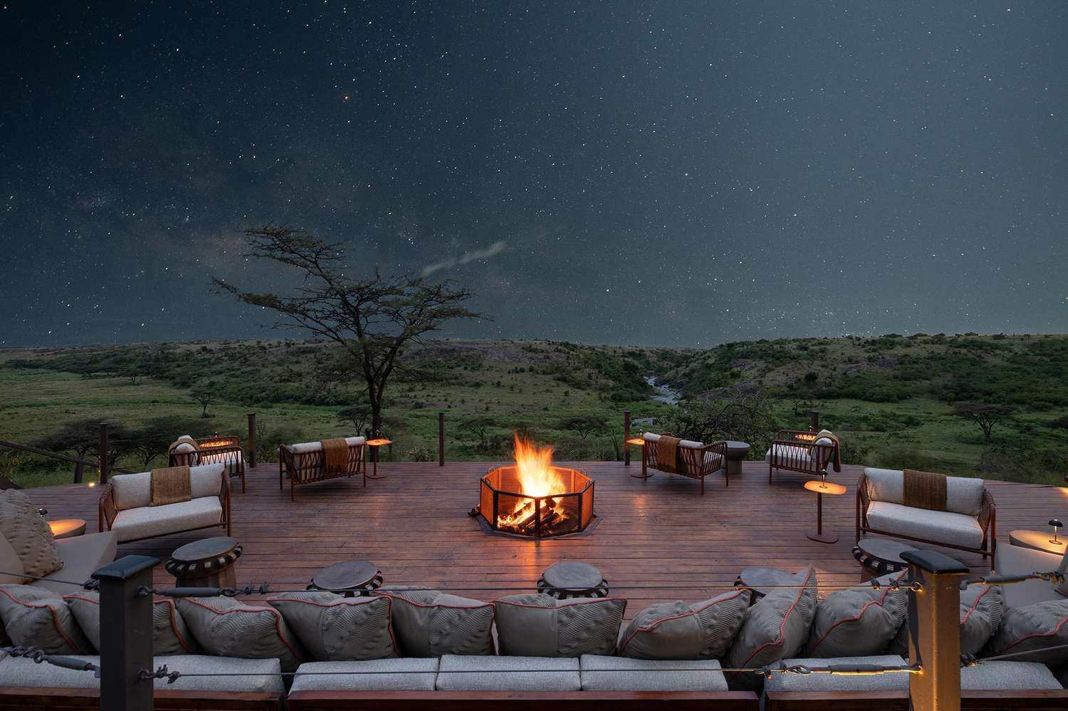 Safari camp fire pit under a starry sky in the Maasai Mara