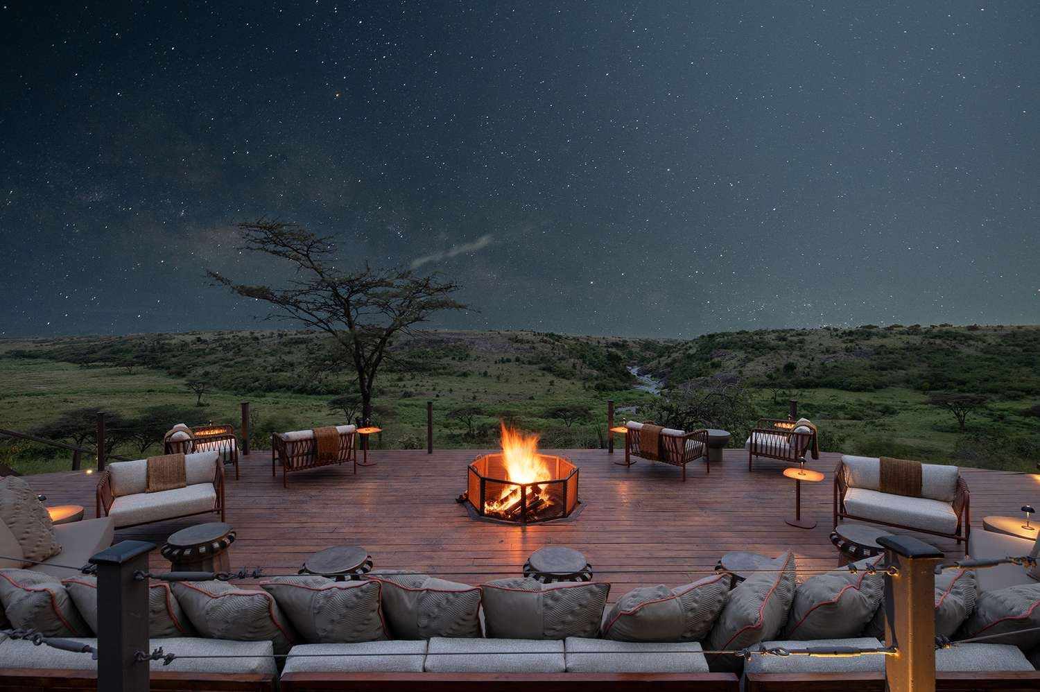 Safari camp fire pit under a starry sky in the Maasai Mara